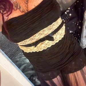 Sleeveless dress or Top with lace.
